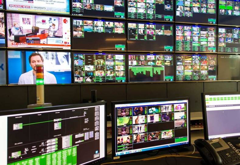Hybrid monitoring NOC dashboard showing DVB and IP/OTT streams in a unified tile view with colour-coded alarm status